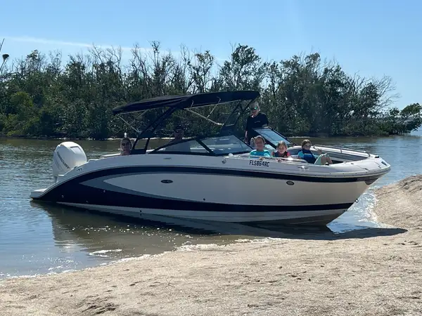 Family at beach with rental boat - Amy's Boat Rental Cape Coral Florida